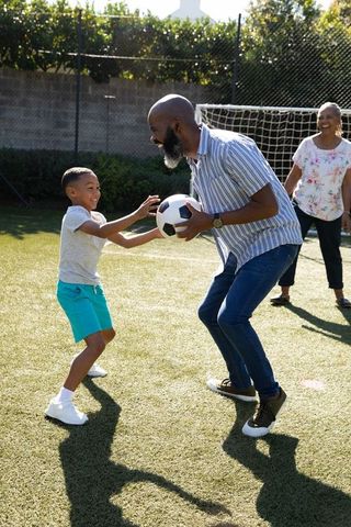 Family Bonding with Outdoor Soccer on Sunny Day