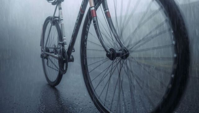 Road bicycle agility in rain emphasizing mobility and adventure