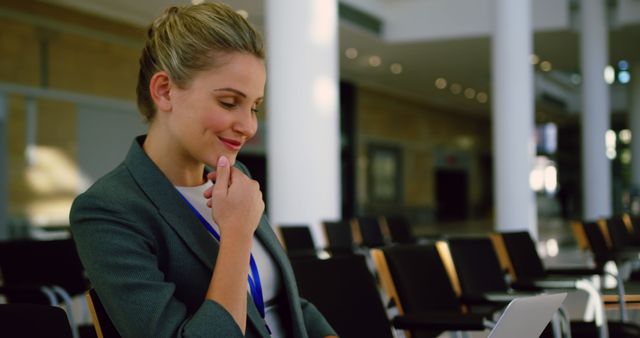 Businesswoman Working on Laptop in Modern Office Building - Download Free Stock Images Pikwizard.com