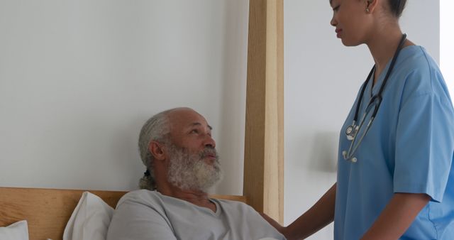 This image is ideal for showcasing compassionate healthcare and the dedication of medical professionals. It can be used in articles, blogs, or websites focusing on elderly care, nursing, patient support, and hospital environments. It highlights the importance of empathy and attentive care in medical settings.