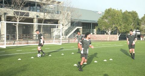Soccer Players Riding Formation During Training Session on Sunny Day