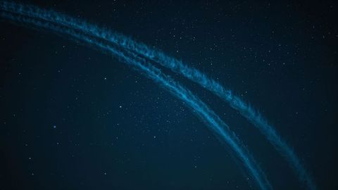 Cosmic Dreamscape with Luminous Contrails in Starry Night Sky