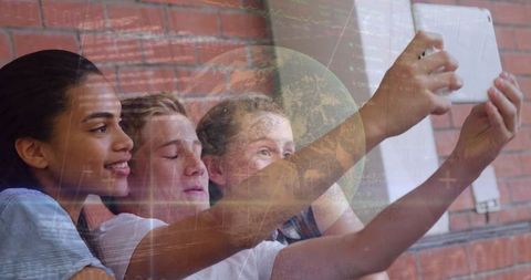 Diverse Students Taking Selfie with Digital World and Economic Graphs