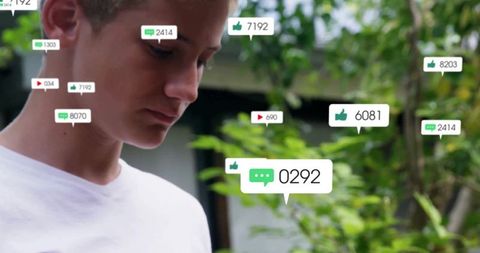 Teenager exploring digital notifications in garden doorway