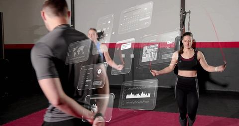 Fitness woman skipping rope with augmented reality workout data overlay in gym studio