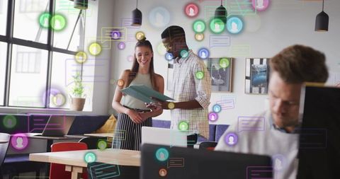 Professionals reviewing documents in modern coworking space with digital chat overlays