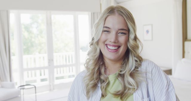 Smiling Woman with Blonde Hair Relaxing at Home - Download Free Stock Images Pikwizard.com