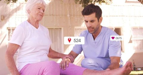 Kneeling caregiver examining senior woman lower leg on porch with social media icons