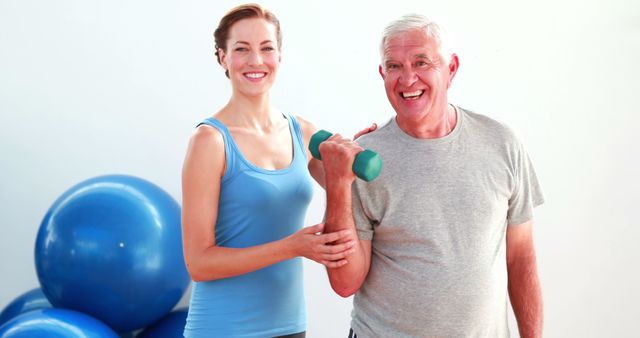 Senior Man Exercising with Female Personal Trainer - Download Free Stock Images Pikwizard.com