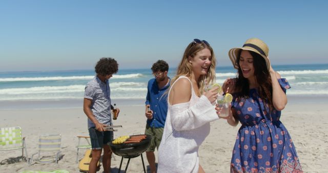 Young Friends Enjoying BBQ and Refreshments on Sunny Beach - Download Free Stock Images Pikwizard.com