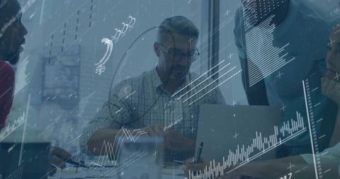 Corporate Team Analyzing Digital Data in Meeting