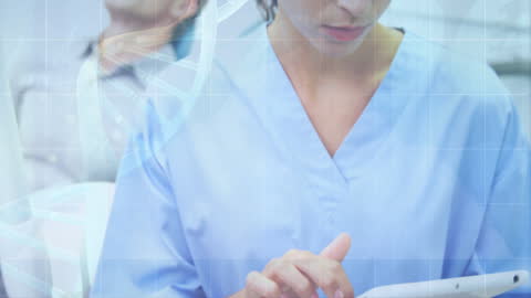 Dentist Analyzing Digital Medical Data on Tablet