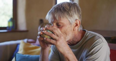 Senior Man Enjoying Coffee at Home in Relaxation