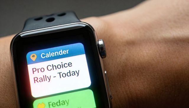 Smartwatch Displaying Calendar Reminder 'Pro Choice Rally - Today' Close-Up on Wrist