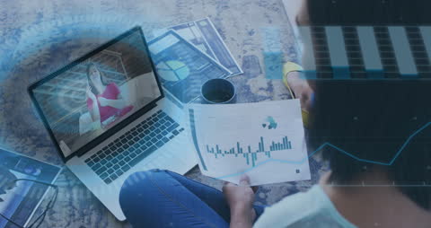 Woman Analyzing Data with Virtual Interface in Modern Workspace