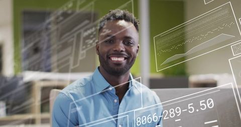 Smiling Businessman with Digital Data Overlays in Office - Download Free Stock Images Pikwizard.com
