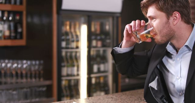 Man drinking whisky in bar, relaxing after work, enjoying evening beverage - Download Free Stock Images Pikwizard.com