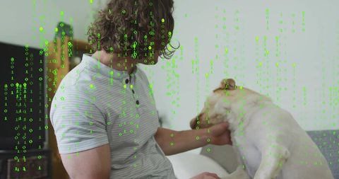 Petting dog on couch with green binary overlay, man interacting with digital data stream