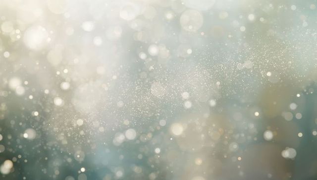 Ethereal glowing bokeh with floating particles and soft sparkling haze backdrop