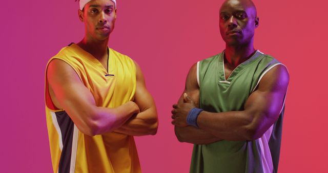 Two Confident Basketball Players in Colorful Uniforms Posing - Download Free Stock Images Pikwizard.com