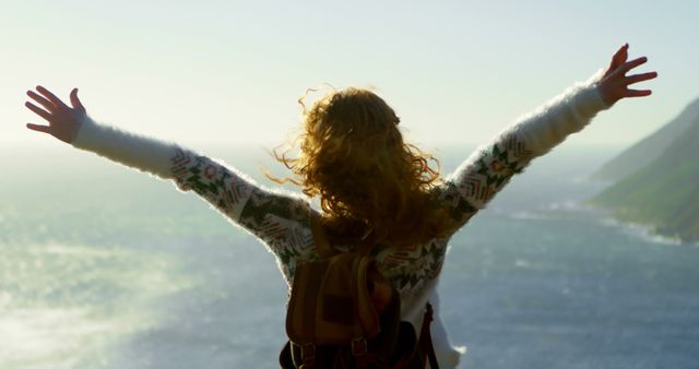 Woman Enjoying Scenic Coastal View with Open Arms - Download Free Stock Images Pikwizard.com