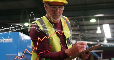 Engineer Analyzing Data with Dynamic Graphs Overlay - Download Free Stock Images Pikwizard.com