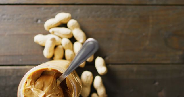 Creamy Peanut Butter Jar with Peanuts on Rustic Wooden Surface - Download Free Stock Images Pikwizard.com