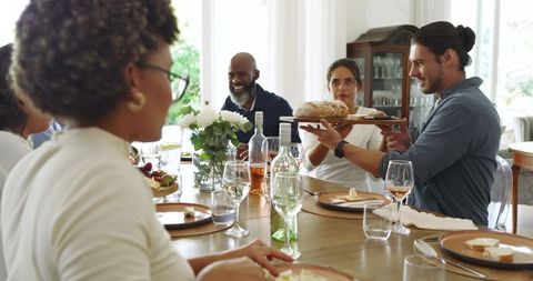 Family and Friends Sharing a Meal with Laughter and Conversation