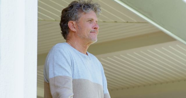 Mature Man Reflecting on Porch during Daytime - Download Free Stock Images Pikwizard.com