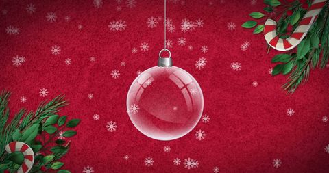 Clear Christmas Bauble Hanging Against Festive Red Background