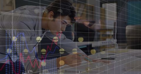 young businessman analyzing financial data at office desk - Download Free Stock Images Pikwizard.com