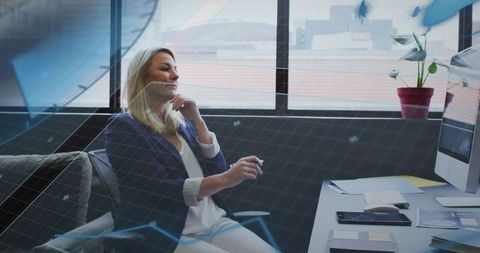 Businesswoman Using Augmented Reality Interface in Modern Urban Office Workspace