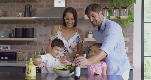 Happy Family Preparing Salad Together in Modern Kitchen - Download Free Stock Images Pikwizard.com