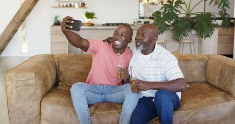Father and Son Bonding Over Drinks and Selfie