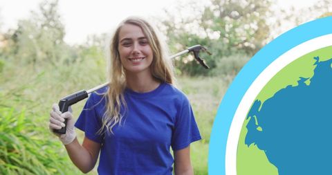 Volunteer smiling while cleaning environment during eco conservation embassy