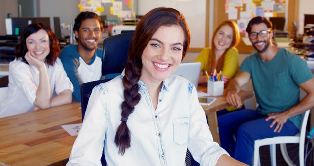 Smiling Young Professionals Collaborating in Modern Office Workspace - Download Free Stock Images Pikwizard.com