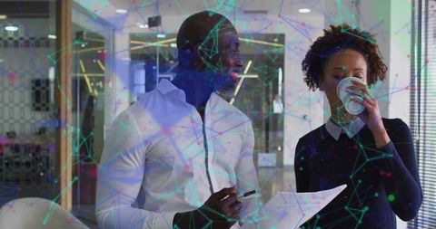 Coworkers Collaborating with Network Graphics in Modern Office