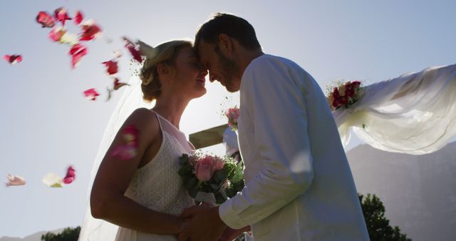 Happy caucasian newly wed couple, standing touching heads at altar outdoors - Download Free Stock Photos Pikwizard.com