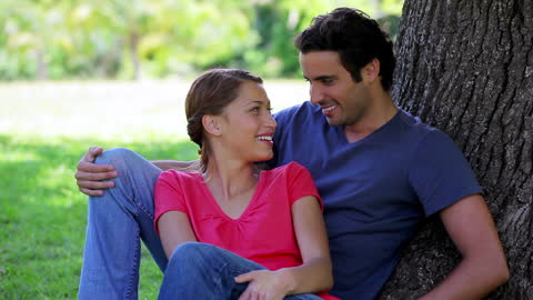 Happy Couple Enjoying Relaxation Time at Park