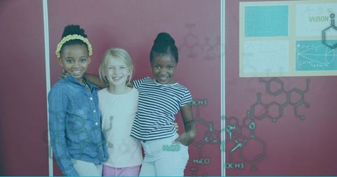 Happy girls teamwork and learning in science classroom