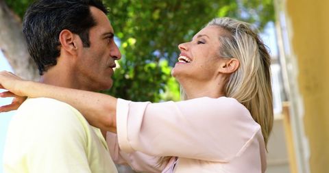 Happy Couple Embracing in Sunny Outdoor Park - Download Free Stock Images Pikwizard.com
