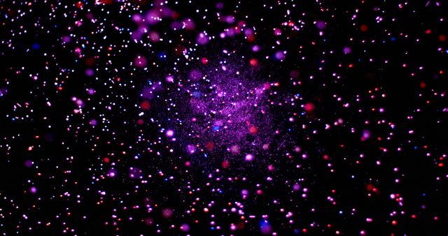 A vibrant display of purple and pink particles against a dark background. Capturing the essence of cosmic beauty, this image resembles a starry night sky or a nebula.