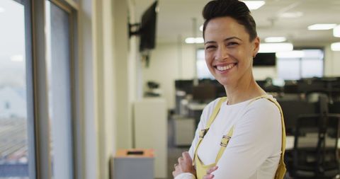 Confident Businesswoman Smiling in Modern Office Workspace - Download Free Stock Images Pikwizard.com