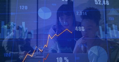 Collaborative Team Working on Business Analytics Dashboard Showing Rising Trend Line