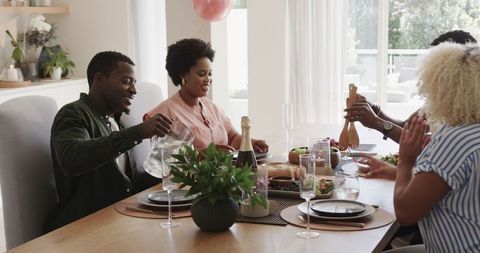 Friends Enjoying Lunch and Laughter at Home