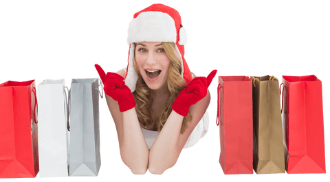Festive Young Woman in Santa Hat with Transparent Shopping Bags Cheerful