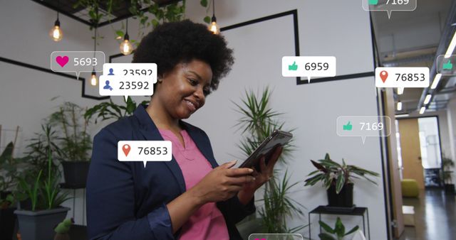 Young woman smiling while using smartphone in modern office with various social media interaction notifications floating around. Ideal for concepts related to social media engagement, digital marketing, modern technology, work-life balance, and workplace dynamics.