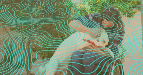 Man in wheelchair hugging white dog outdoors