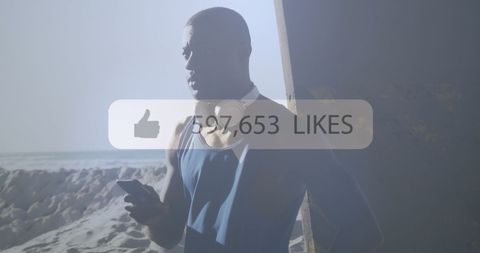 Athletic Man Engaged on Smartphone by Beach with Social Media Icon - Download Free Stock Images Pikwizard.com
