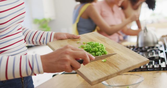 Hands Chopping Green Vegetables on Cutting Board in Home Kitchen - Download Free Stock Images Pikwizard.com